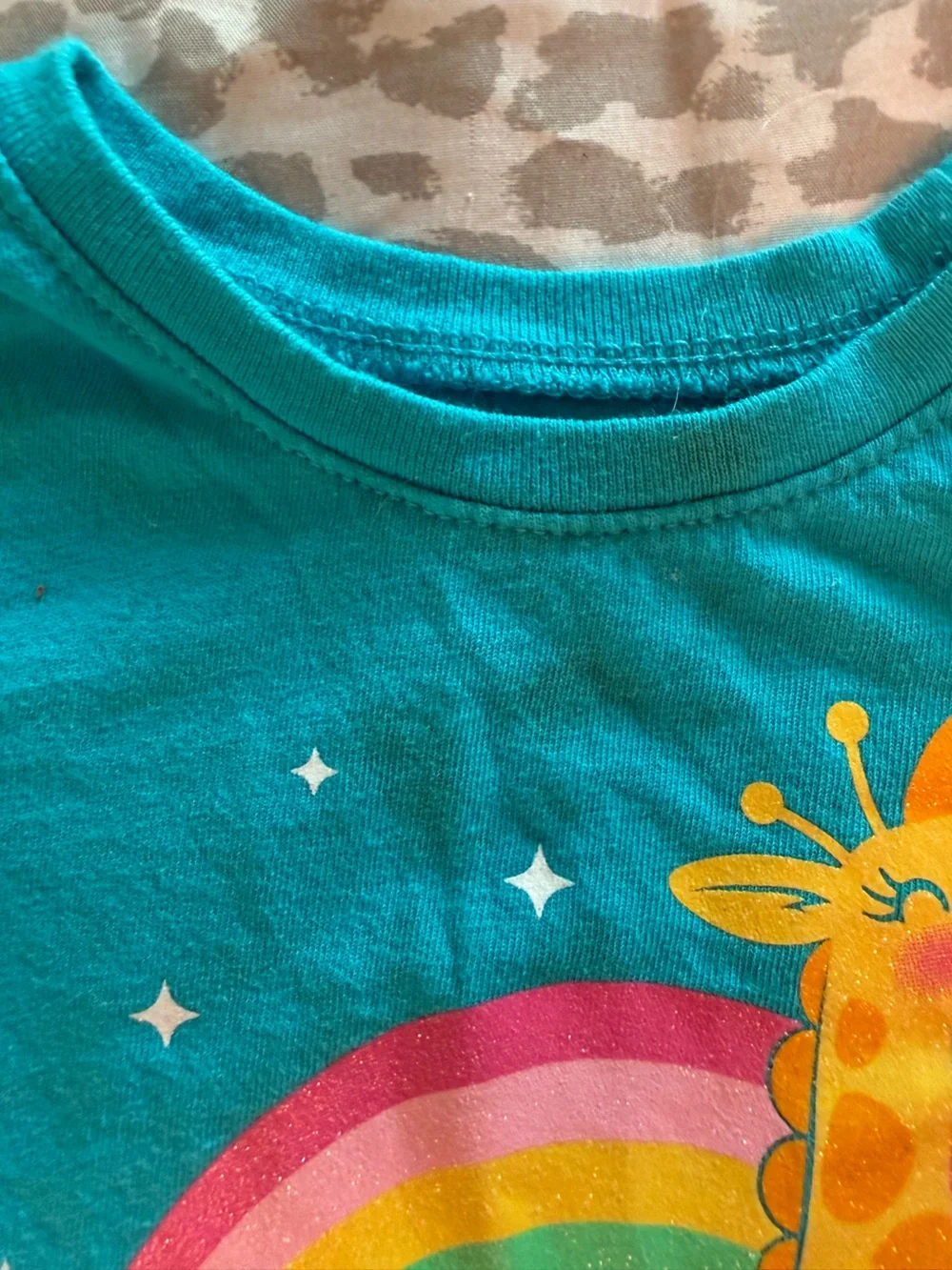 Turquoise Kids Tee with Roller-Skating Giraffe and Rainbow